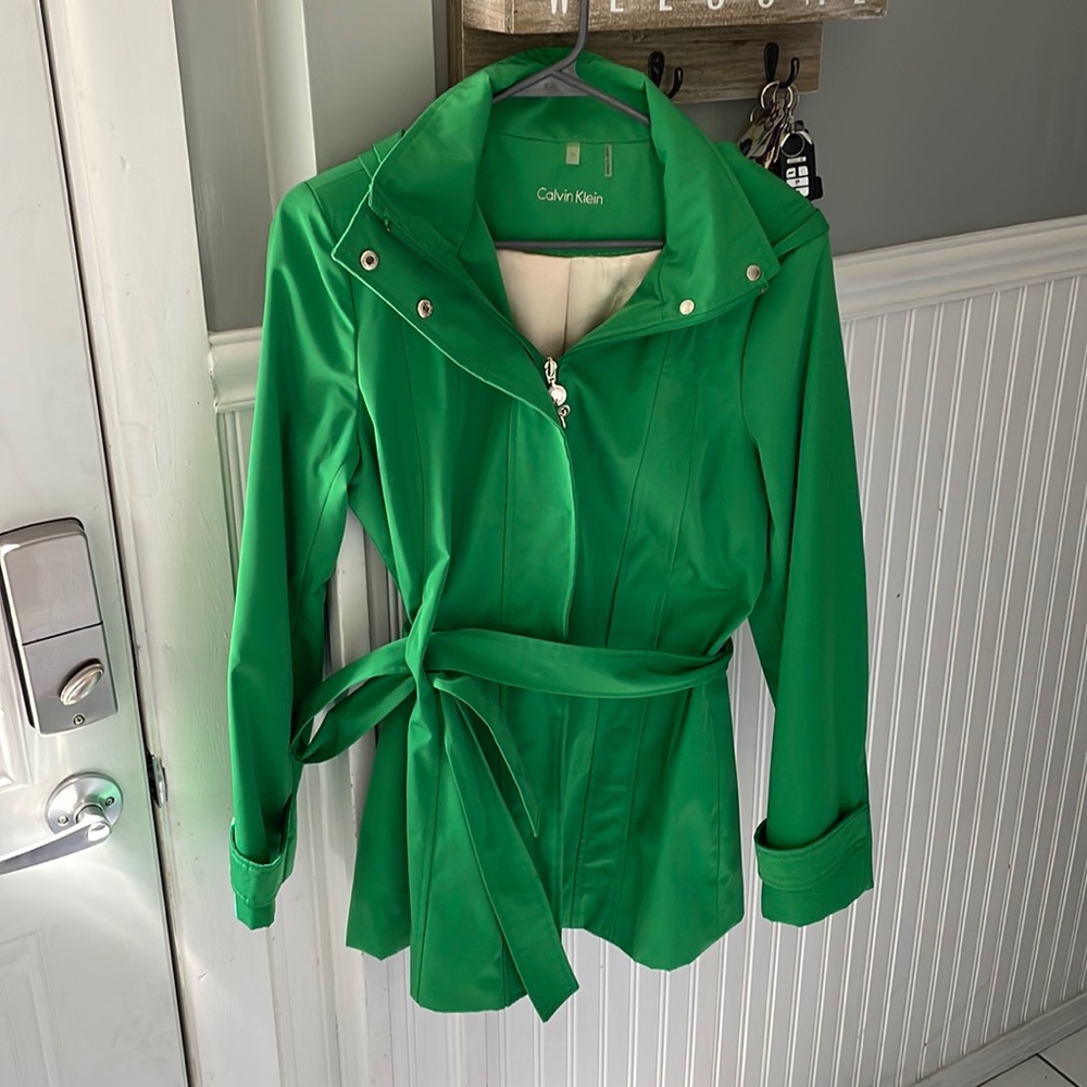 Green Calvin Klein rain coat with hood
